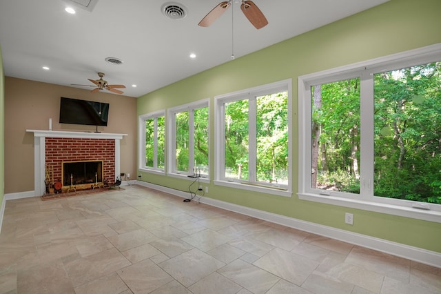 3315 Seaside Rd, Exmore, VA 23350 - unfurnished living room featuring a ceiling fan, baseboards, a fireplace, recessed lighting, and light stone finish flooring