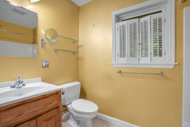 3315 Seaside Rd, Exmore, VA 23350 - full bathroom with toilet, vanity, baseboards, and a shower