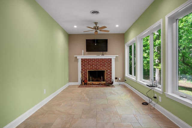 3315 Seaside Rd, Exmore, VA 23350 - unfurnished living room with ceiling fan, a brick fireplace, baseboards, stone finish floors, and recessed lighting