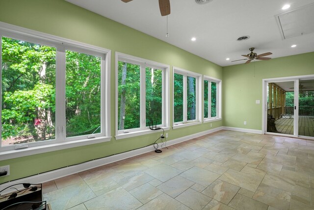 3315 Seaside Rd, Exmore, VA 23350 - unfurnished sunroom featuring baseboards, stone tile flooring, and recessed lighting