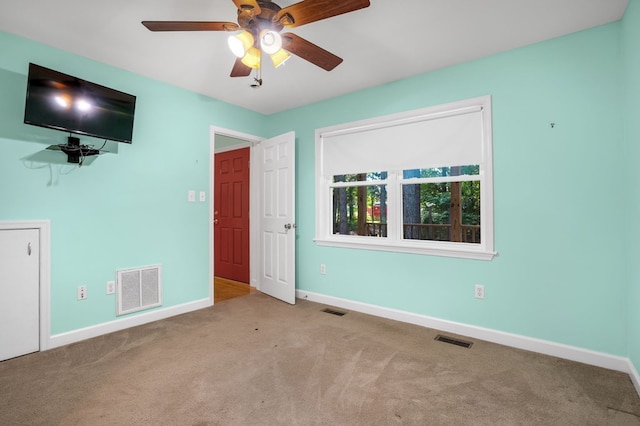 3315 Seaside Rd, Exmore, VA 23350 - unfurnished bedroom featuring baseboards, carpet flooring, and a ceiling fan