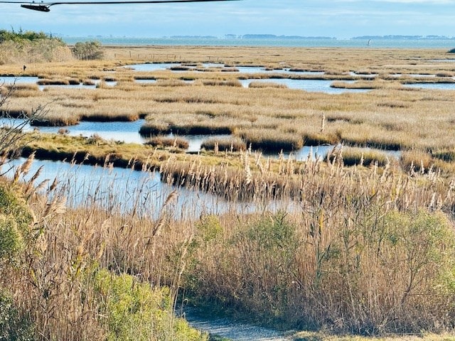 bird's eye view with a rural view and a water view