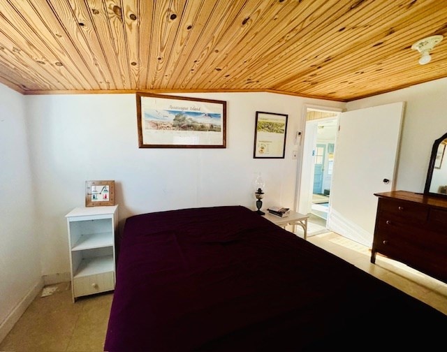 bedroom featuring wooden ceiling and vaulted ceiling