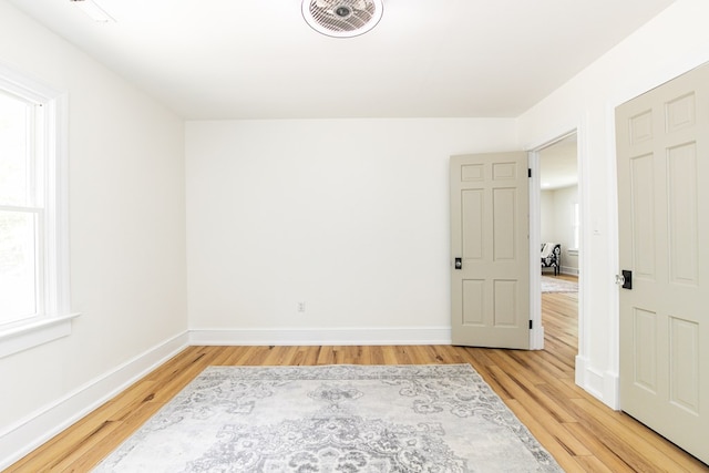 24455 Guilford Rd, Bloxom, VA 23308 - empty room featuring light wood-style floors and baseboards