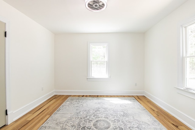 24455 Guilford Rd, Bloxom, VA 23308 - spare room featuring plenty of natural light, light wood-type flooring, and baseboards