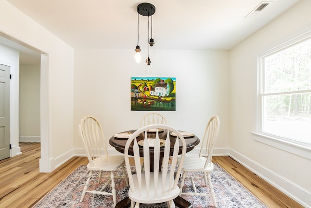 24455 Guilford Rd, Bloxom, VA 23308 - dining space with light wood-type flooring, healthy amount of natural light, and baseboards