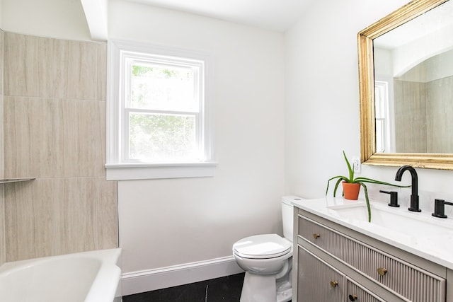 24455 Guilford Rd, Bloxom, VA 23308 - full bathroom with toilet, vanity, and baseboards