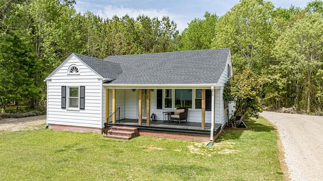24455 Guilford Rd, Bloxom, VA 23308 - view of front facade featuring roof with shingles, a front yard, and covered porch
