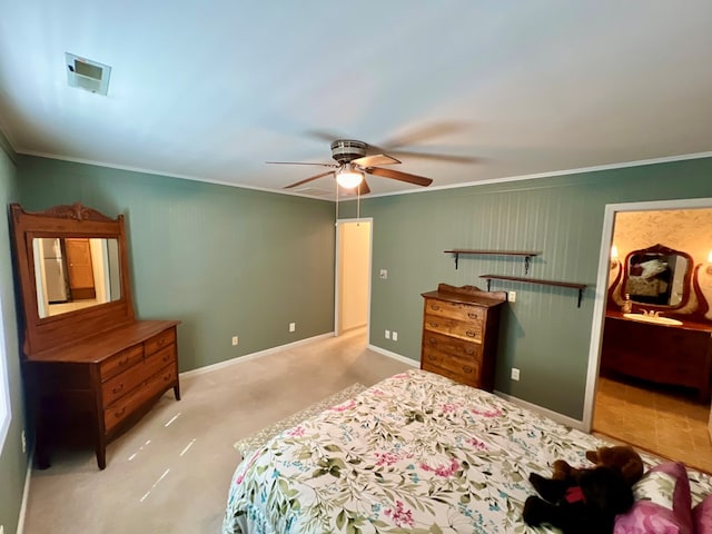 bedroom featuring ceiling fan, light colored carpet, and ornamental molding