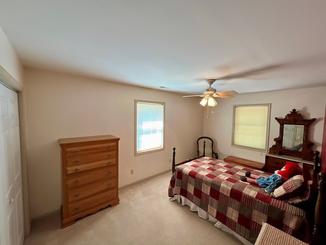 carpeted bedroom featuring ceiling fan