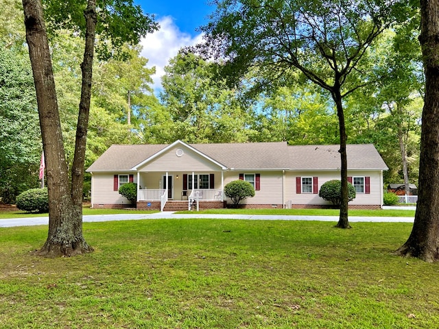 single story home with a front lawn and covered porch