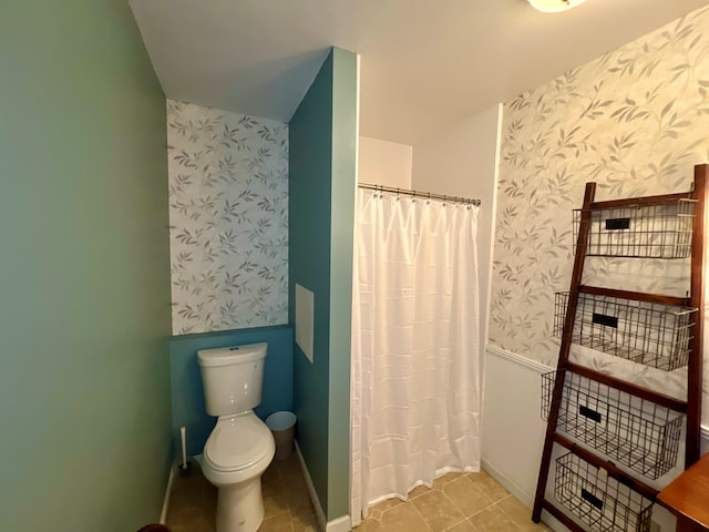 bathroom with toilet and walk in shower