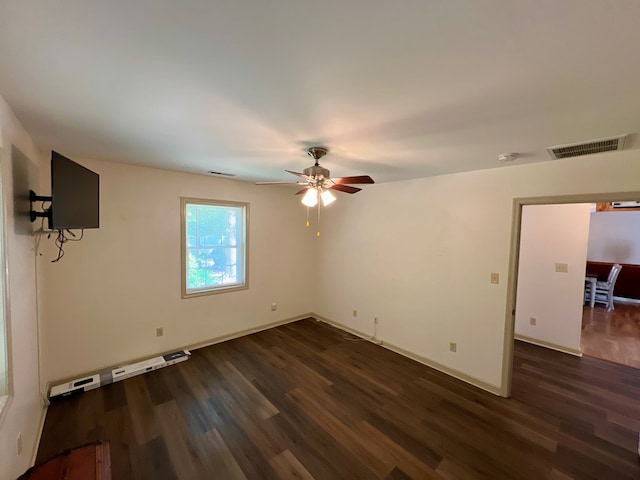 empty room with dark hardwood / wood-style floors and ceiling fan