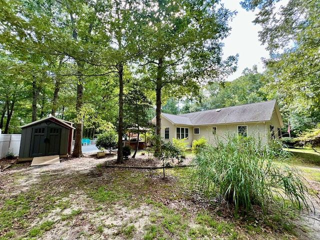 view of yard with a storage shed