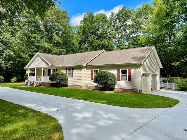 ranch-style house with a front lawn and a garage