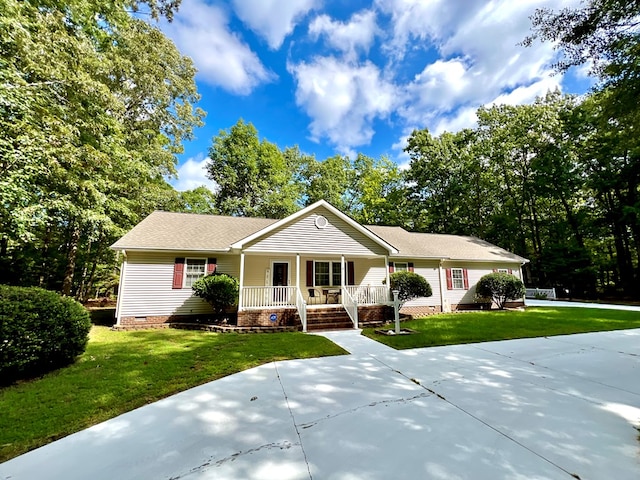 ranch-style house with a front lawn and covered porch