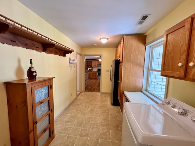 bathroom with separate washer and dryer