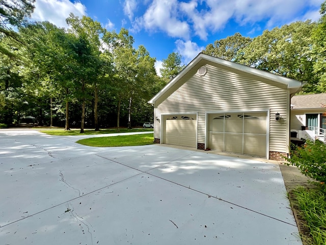 view of side of home with a yard