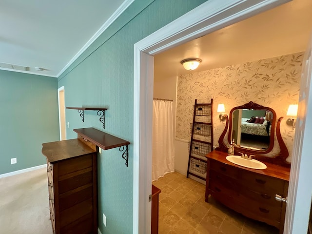 bathroom featuring vanity and ornamental molding