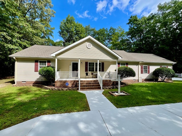 ranch-style house with covered porch and a front lawn