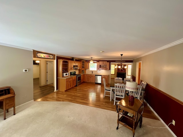 carpeted living room featuring crown molding and a notable chandelier