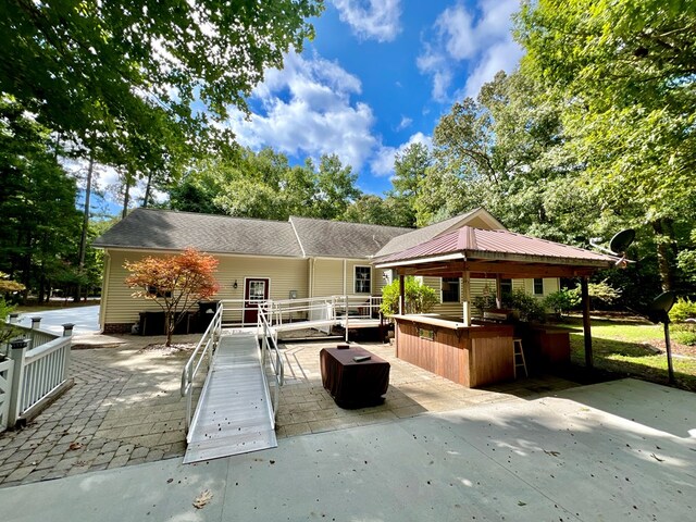 exterior space with a bar and a gazebo