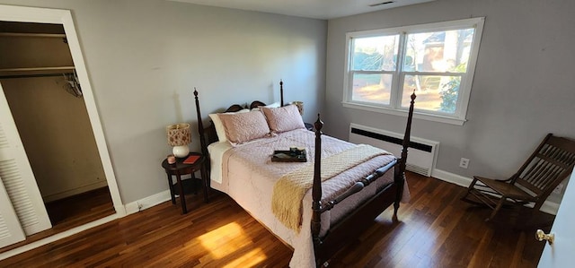 10117 Pine Ave, Nassawadox, VA 23413 - bedroom with radiator heating unit, a closet, baseboards, and wood finished floors