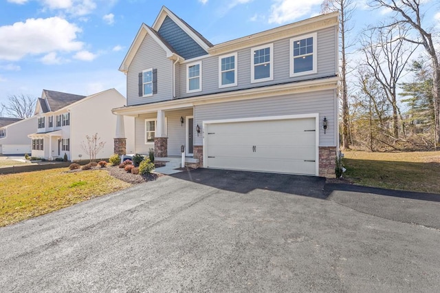 view of front of property with a garage and a front yard