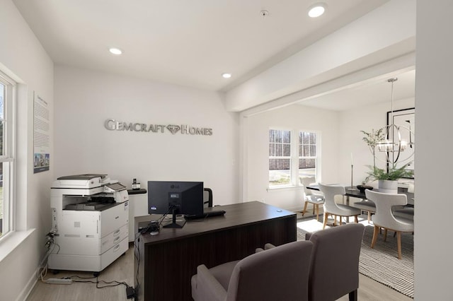 office with a chandelier and light hardwood / wood-style floors