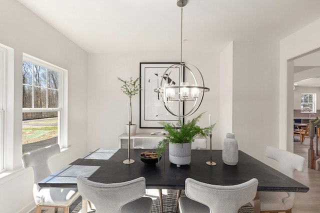 dining area featuring an inviting chandelier