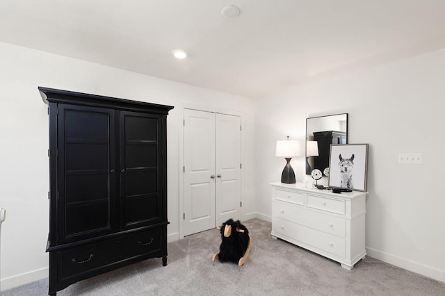 bedroom with light carpet