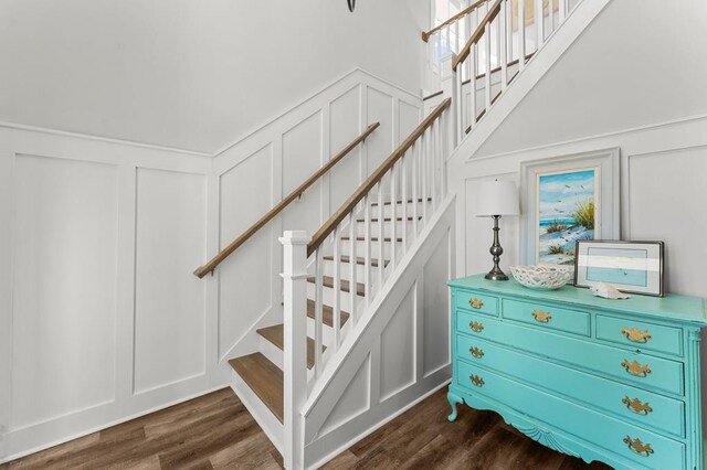 entryway with dark hardwood / wood-style flooring