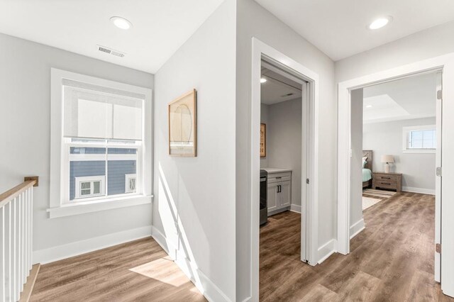 stairway featuring hardwood / wood-style flooring