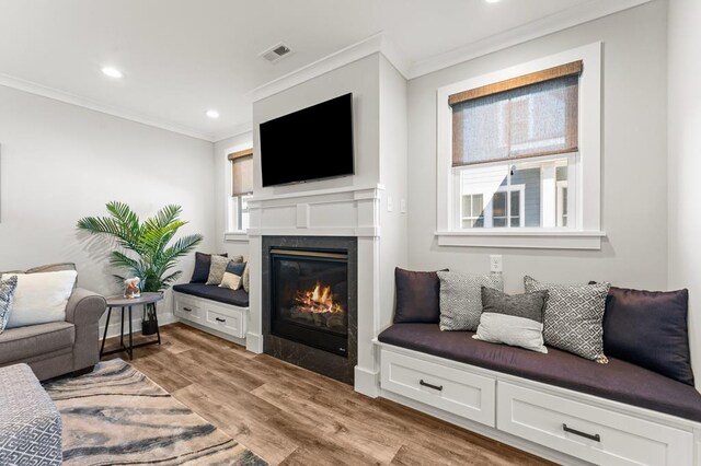 dining area with dark wood-type flooring and crown molding