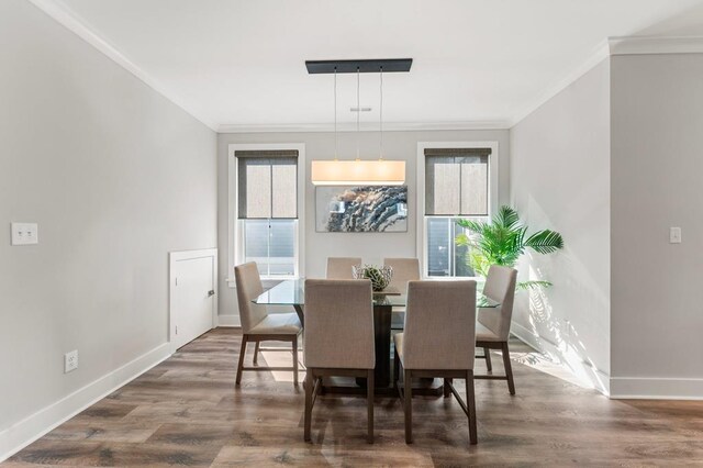 kitchen with premium appliances, dark wood-type flooring, sink, gray cabinets, and a kitchen island