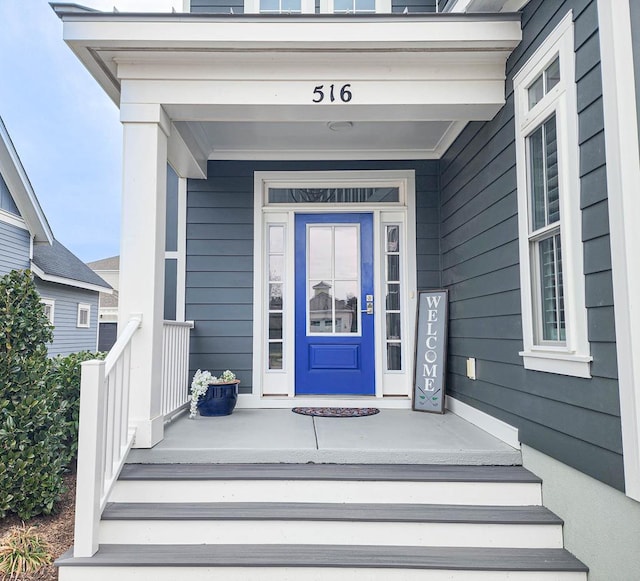 property entrance featuring covered porch