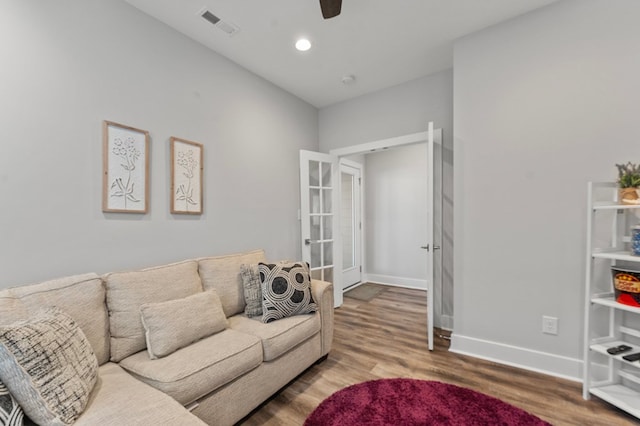 living room with french doors, hardwood / wood-style flooring, and ceiling fan