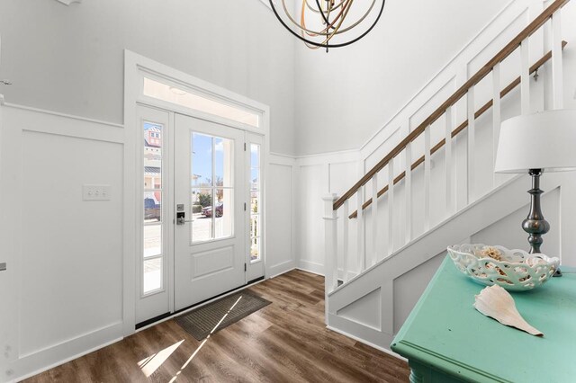 living room featuring wood-type flooring and ornamental molding