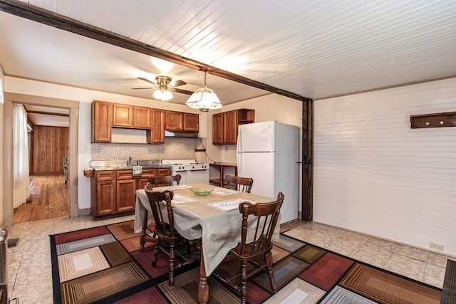 24103 Adelaide St, Parksley, VA 23421 - dining room with wood walls and a ceiling fan