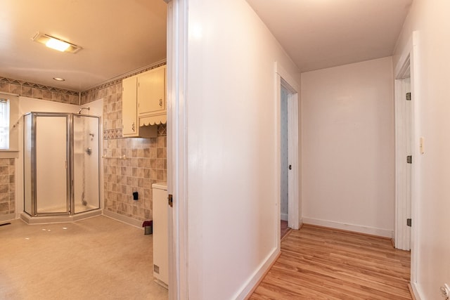 24103 Adelaide St, Parksley, VA 23421 - hallway featuring tile walls and light wood-type flooring