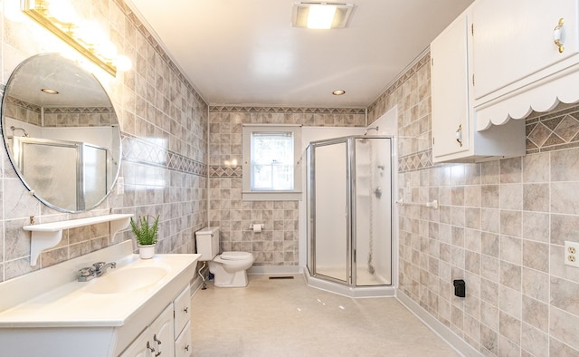24103 Adelaide St, Parksley, VA 23421 - bathroom featuring tile walls, vanity, a shower stall, and tile patterned flooring