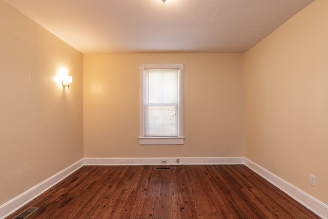 24103 Adelaide St, Parksley, VA 23421 - empty room featuring dark wood-type flooring and baseboards