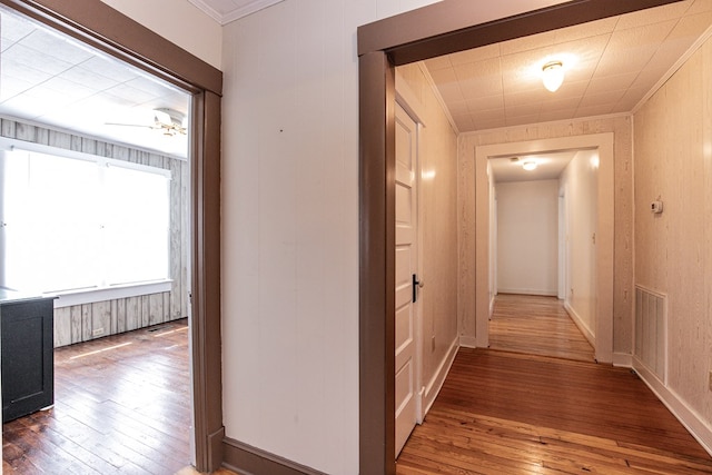 24103 Adelaide St, Parksley, VA 23421 - hallway featuring wood-type flooring and crown molding