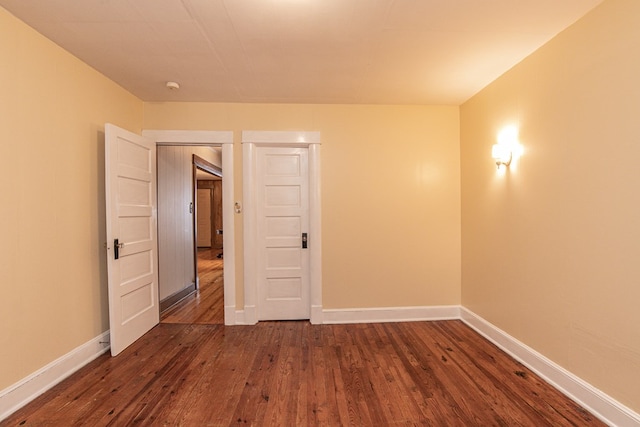 24103 Adelaide St, Parksley, VA 23421 - empty room featuring dark wood finished floors and baseboards