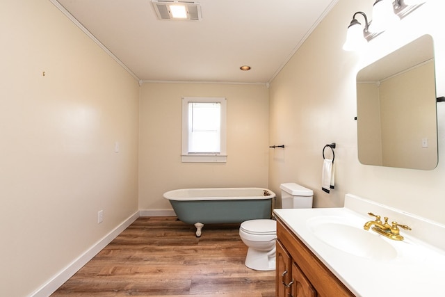 24103 Adelaide St, Parksley, VA 23421 - full bathroom with a soaking tub, vanity, ornamental molding, and wood finished floors