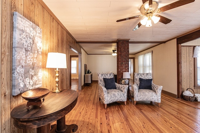24103 Adelaide St, Parksley, VA 23421 - sitting room with ceiling fan, ornamental molding, light wood finished floors, and wooden walls