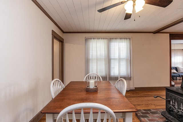 24103 Adelaide St, Parksley, VA 23421 - dining space with ornamental molding, a ceiling fan, and dark wood-style floors
