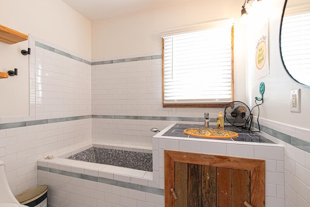 521 Madison Ave, Cape Charles, VA 23310 - bathroom with tile walls and a wealth of natural light