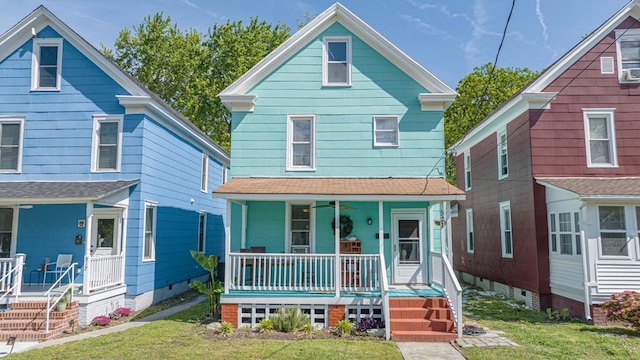 521 Madison Ave, Cape Charles, VA 23310 - traditional style home featuring a front lawn, a porch, and roof with shingles