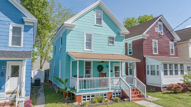 521 Madison Ave, Cape Charles, VA 23310 - view of front of home featuring a porch, a shingled roof, a ceiling fan, and central AC unit